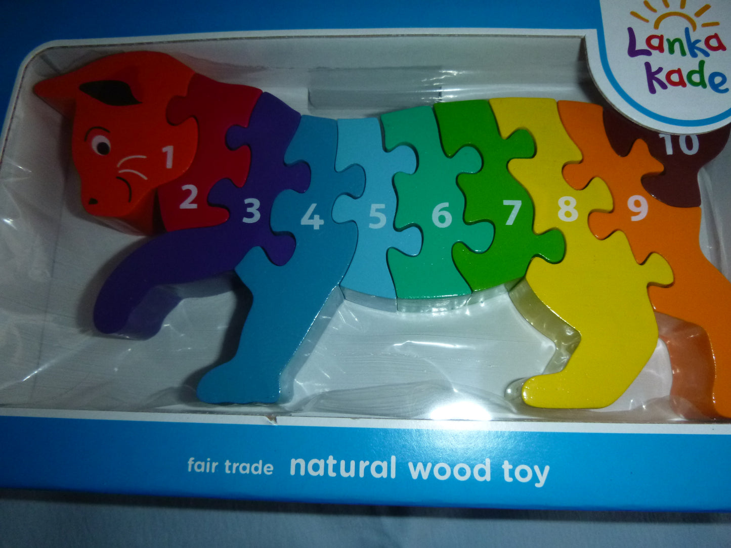 Katze oder bunter Dino als Holz-Puzzle im Regenbogen-Look
